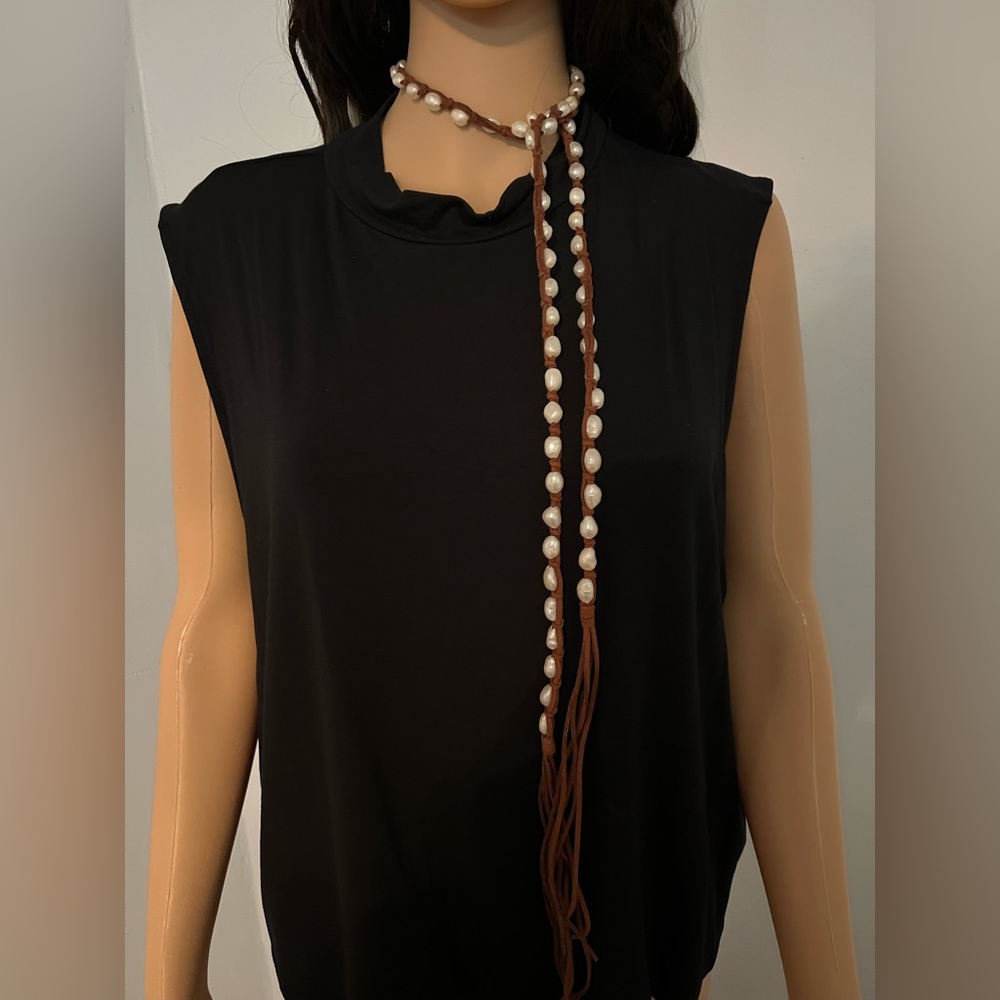 FRESH WATER PERL NECKLACE ON NATURAL LEATHER . 60 FRESH WATER PERLS .